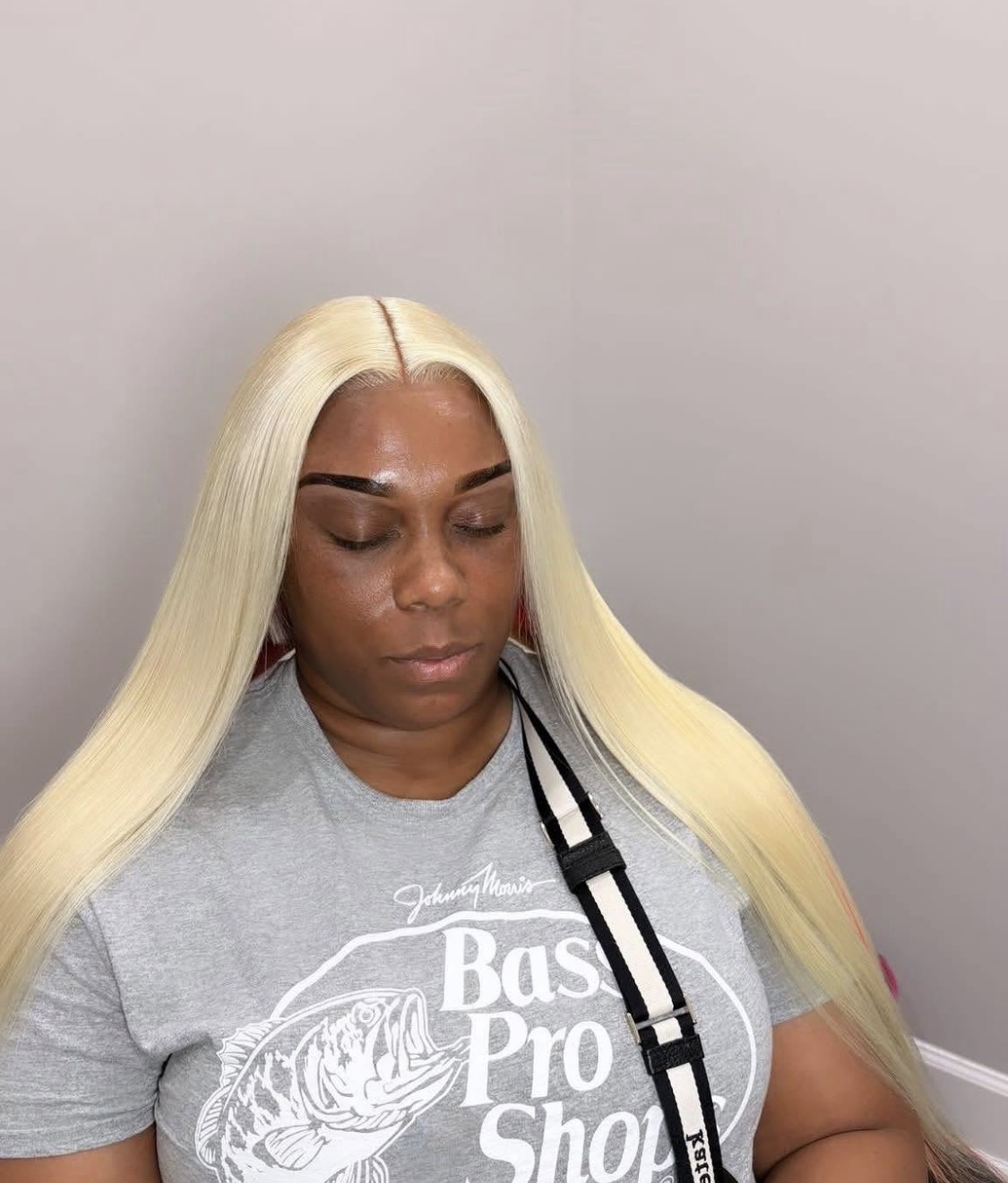 Long platinum blonde hair with a clean middle part