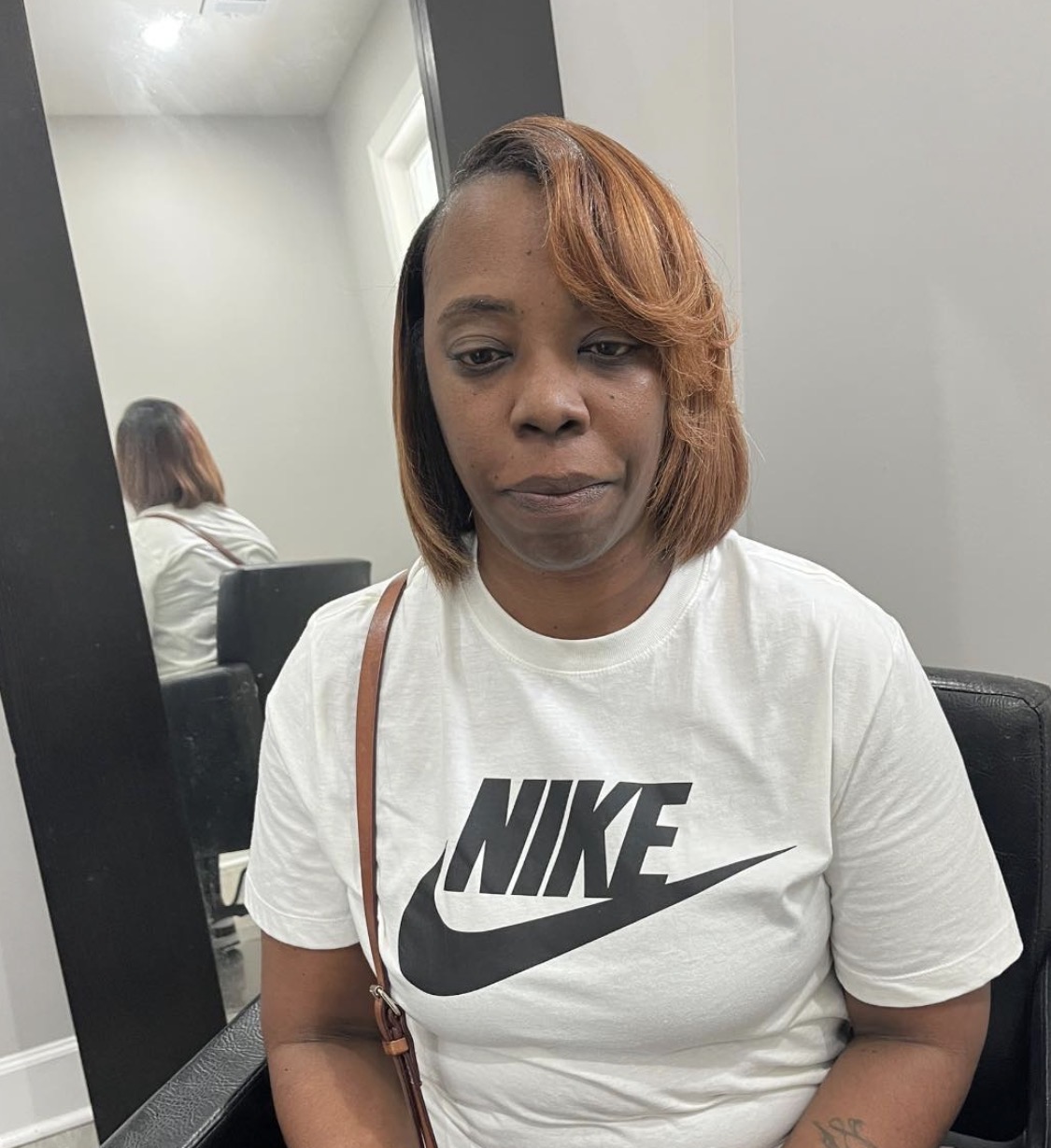 Precision bob cut with warm caramel highlights